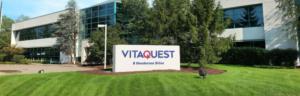 The exterior of Vitaquest's headquarters building with the company signboard at 8 Henderson Drive.