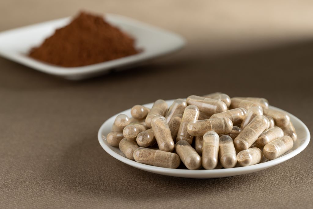 A plate of beef liver supplements spread out on a white plate.