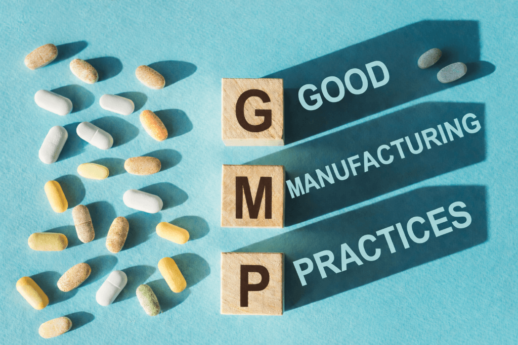 GMP Certified Supplements spread out against a blue background and block letters that spell GMP.