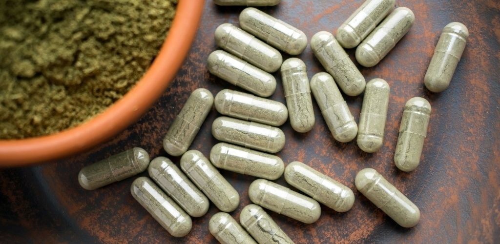 Organic certification meaning in supplements illustrated by plant-based capsules and herbal powder