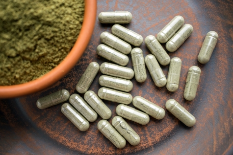 Organic certification meaning in supplements illustrated by plant-based capsules and herbal powder