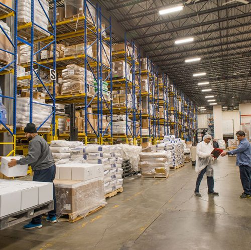 Large Vitaquest Warehouse active business work day with ingredients and orders for custom formulated manufacturing of vitamin supplements and nutraceuticals
